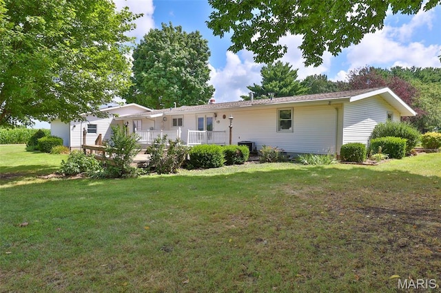 613 N W St, Raymond, IL 62560 - view of front of home with a front lawn and a wooden deck