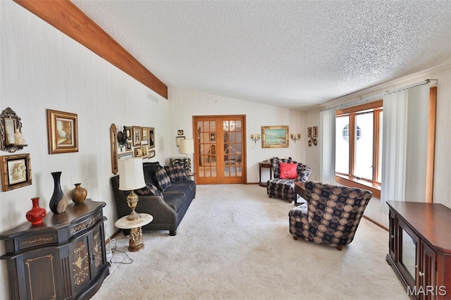 613 N W St, Raymond, IL 62560 - living room with lofted ceiling, french doors, a textured ceiling, and carpet