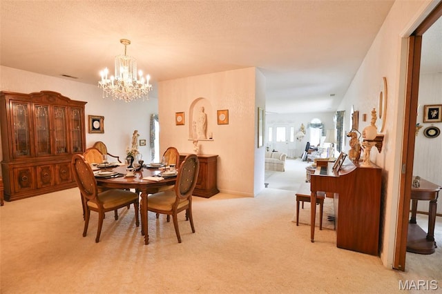 613 N W St, Raymond, IL 62560 - dining space with carpet and a chandelier