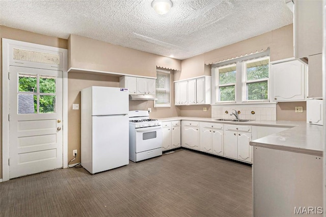 11714 Larimore Rd, Saint Louis, MO 63138 - kitchen featuring white appliances, white cabinetry, light countertops, healthy amount of natural light, and a textured ceiling
