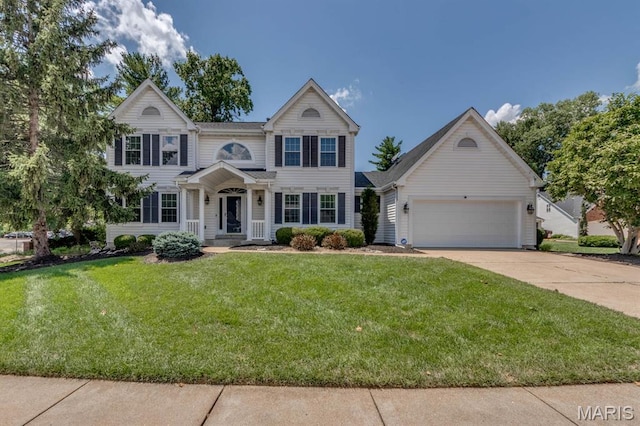 13153 Barrett Meadows Dr, Ballwin, MO 63021 - view of front of home with concrete driveway, an attached garage, and a front yard