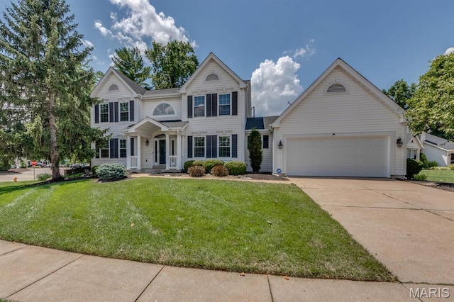 13153 Barrett Meadows Dr, Ballwin, MO 63021 - view of front of home with driveway, an attached garage, and a front lawn