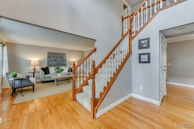 13153 Barrett Meadows Dr, Ballwin, MO 63021 - stairway featuring wood finished floors and ornamental molding