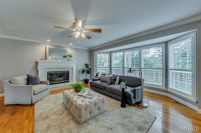 13153 Barrett Meadows Dr, Ballwin, MO 63021 - living room featuring a ceiling fan, crown molding, a fireplace, wood finished floors, and recessed lighting