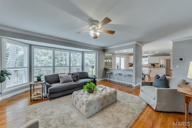 13153 Barrett Meadows Dr, Ballwin, MO 63021 - living area featuring ornamental molding, a ceiling fan, wood finished floors, and recessed lighting
