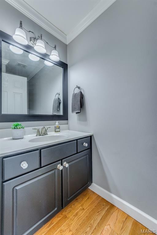 13153 Barrett Meadows Dr, Ballwin, MO 63021 - bathroom featuring crown molding, wood finished floors, and vanity