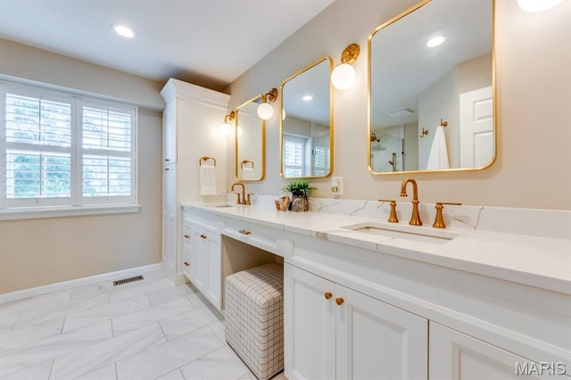 13153 Barrett Meadows Dr, Ballwin, MO 63021 - bathroom featuring healthy amount of natural light, double vanity, recessed lighting, and marble finish floors