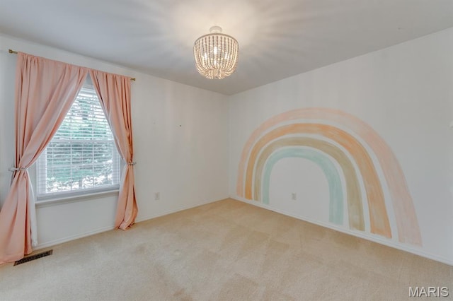 13153 Barrett Meadows Dr, Ballwin, MO 63021 - carpeted spare room featuring a chandelier and baseboards