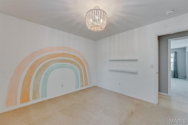 13153 Barrett Meadows Dr, Ballwin, MO 63021 - carpeted empty room featuring a smoke detector and a chandelier