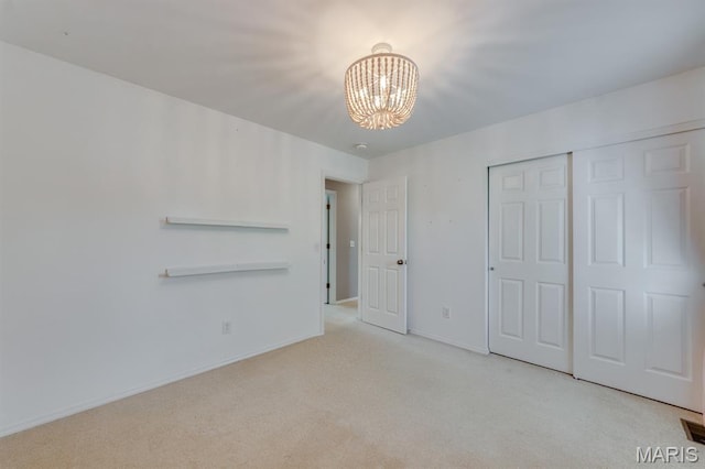 13153 Barrett Meadows Dr, Ballwin, MO 63021 - unfurnished bedroom featuring a chandelier, carpet, and a closet