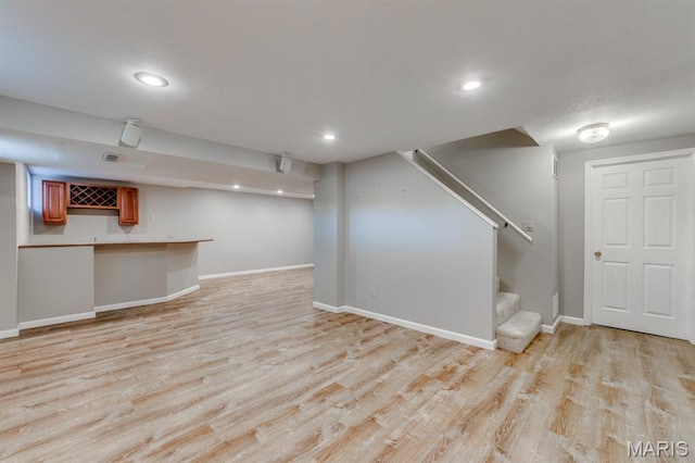 13153 Barrett Meadows Dr, Ballwin, MO 63021 - finished basement with stairs, light wood-style flooring, bar, and recessed lighting