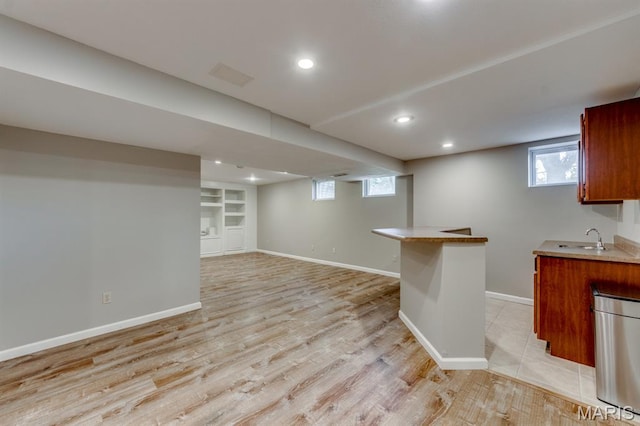 13153 Barrett Meadows Dr, Ballwin, MO 63021 - below grade area with light wood-style floors, recessed lighting, healthy amount of natural light, and bar