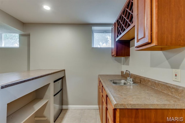 13153 Barrett Meadows Dr, Ballwin, MO 63021 - kitchen with brown cabinetry, light tile patterned floors, recessed lighting, and open shelves