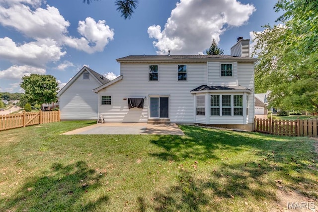13153 Barrett Meadows Dr, Ballwin, MO 63021 - rear view of house featuring a patio area, a chimney, and a fenced backyard
