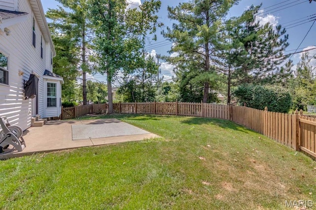13153 Barrett Meadows Dr, Ballwin, MO 63021 - fenced backyard featuring a patio area and view of wooded area