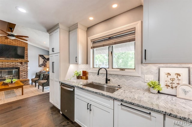 3534 Carriage Run Dr, Saint Charles, MO 63303 - kitchen featuring stainless steel dishwasher, ceiling fan, decorative backsplash, dark wood-style floors, and lofted ceiling