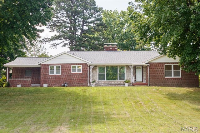 110 N 74th St, Belleville, IL 62223 - ranch-style house with a front lawn, stone siding, a chimney, and brick siding