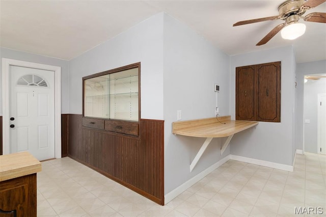 110 N 74th St, Belleville, IL 62223 - entrance foyer with ceiling fan, wainscoting, and light floors