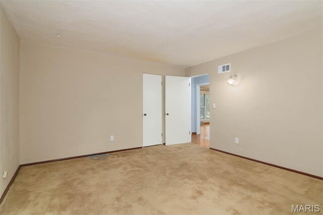 110 N 74th St, Belleville, IL 62223 - unfurnished room with light colored carpet