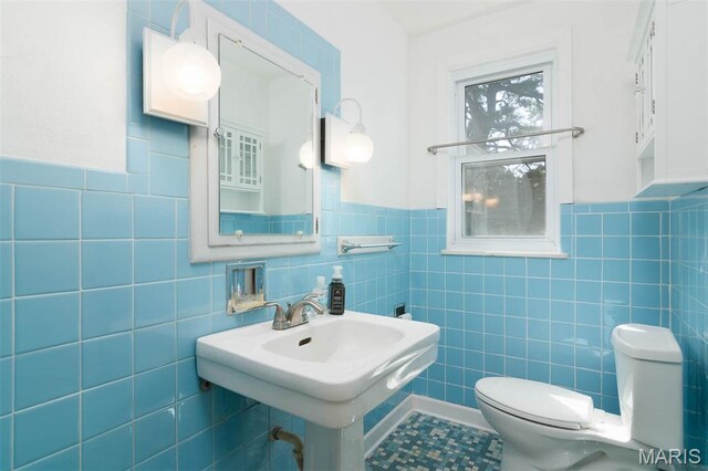 110 N 74th St, Belleville, IL 62223 - half bathroom with tile walls and wainscoting