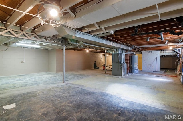 110 N 74th St, Belleville, IL 62223 - unfinished basement featuring water heater and heating unit