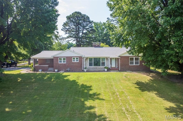 110 N 74th St, Belleville, IL 62223 - ranch-style house with a front lawn and brick siding