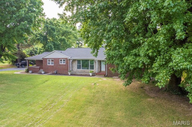 110 N 74th St, Belleville, IL 62223 - view of front of house featuring a front lawn, brick siding, and stone siding