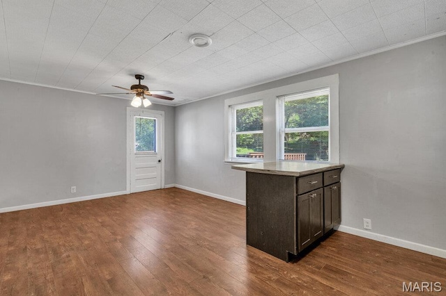 401 Estelle Ave, Ferguson, MO 63135 - spare room featuring ceiling fan, dark wood finished floors, and crown molding