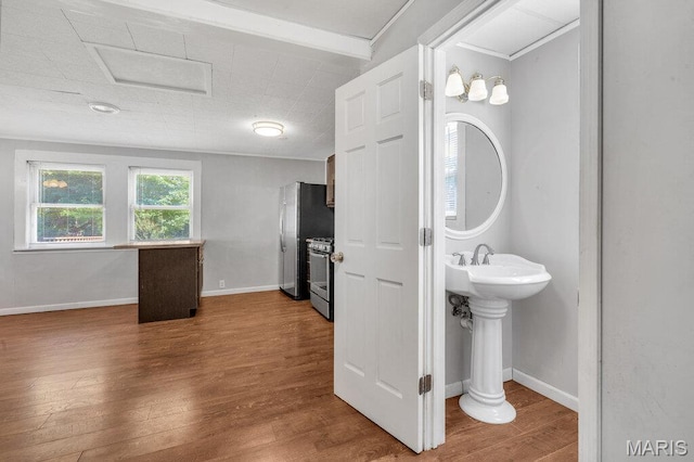 401 Estelle Ave, Ferguson, MO 63135 - bathroom featuring wood finished floors and baseboards