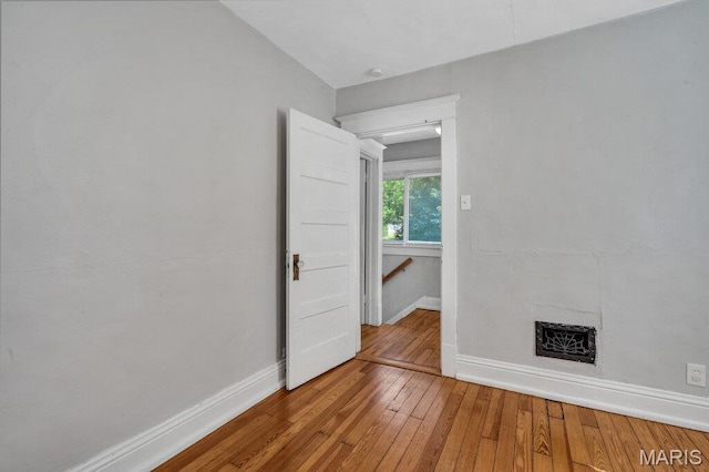 401 Estelle Ave, Ferguson, MO 63135 - empty room featuring baseboards and hardwood / wood-style flooring