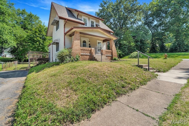 401 Estelle Ave, Ferguson, MO 63135 - view of front facade featuring a porch and brick siding