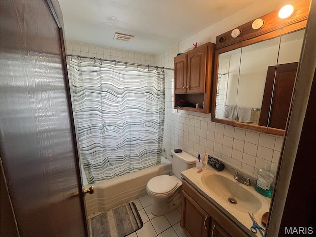 821 Center St, East Alton, IL 62024 - full bathroom with tile walls, shower / bath combo, tile patterned flooring, vanity, and decorative backsplash