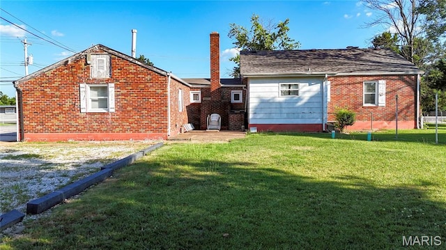 2801 High Ridge Blvd, High Ridge, MO 63049 - back of house with a chimney, a yard, and brick siding