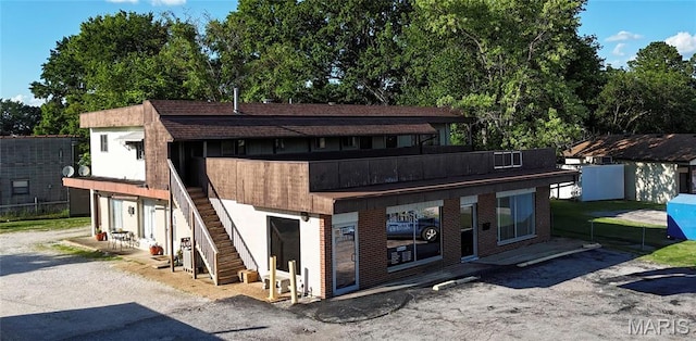 2801 High Ridge Blvd, High Ridge, MO 63049 - view of front facade featuring stairway and view of wooded area
