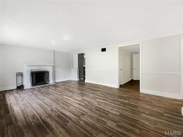614 Conover Ln, Saint Louis, MO 63126 - unfurnished living room with dark wood-style flooring, a fireplace, and recessed lighting