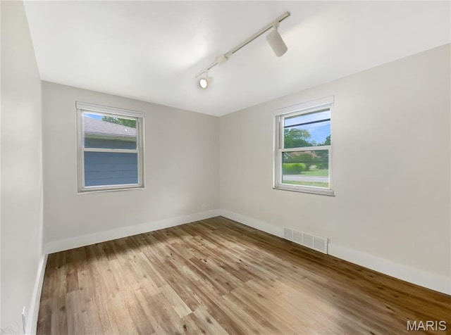614 Conover Ln, Saint Louis, MO 63126 - unfurnished room featuring light wood-style flooring and track lighting