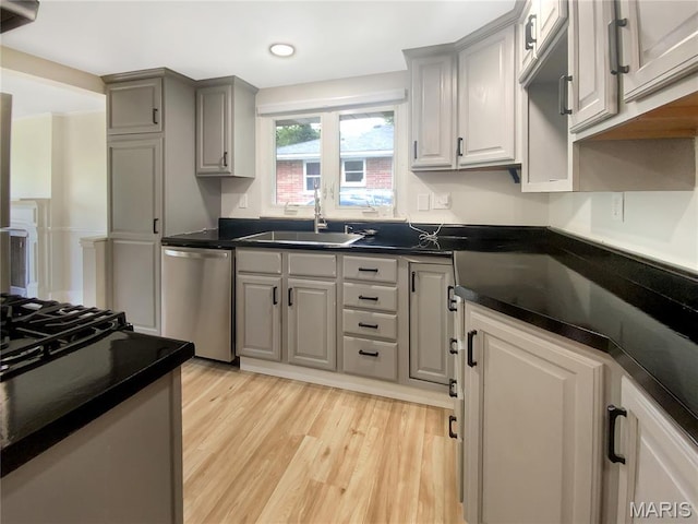 614 Conover Ln, Saint Louis, MO 63126 - kitchen featuring stainless steel dishwasher, dark countertops, light wood finished floors, gray cabinets, and recessed lighting