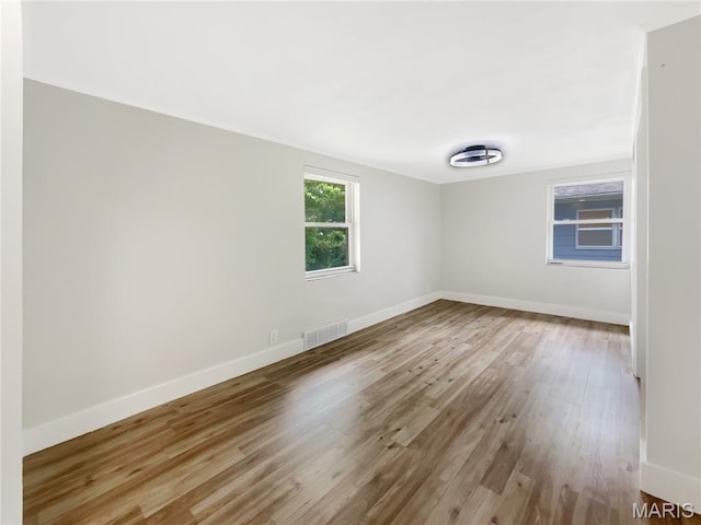 614 Conover Ln, Saint Louis, MO 63126 - spare room featuring wood finished floors and baseboards