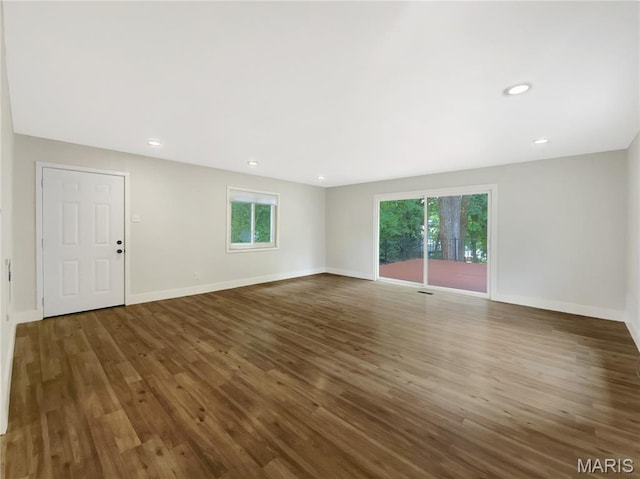 614 Conover Ln, Saint Louis, MO 63126 - spare room featuring healthy amount of natural light, wood finished floors, and recessed lighting