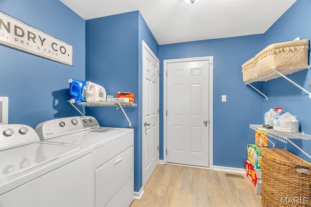 688 Rabbit Run Dr, Wentzville, MO 63385 - laundry room featuring separate washer and dryer and light wood-type flooring