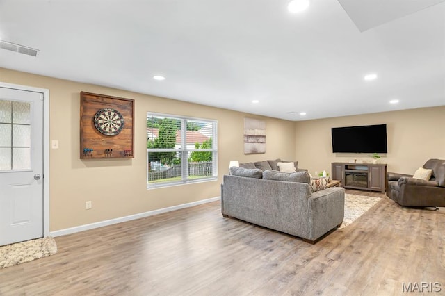 688 Rabbit Run Dr, Wentzville, MO 63385 - living room featuring light wood finished floors and recessed lighting