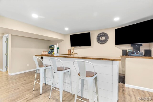 688 Rabbit Run Dr, Wentzville, MO 63385 - indoor bar with light wood-style flooring and recessed lighting