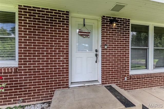 304 Warren St, Richland, MO 65556 - property entrance with brick siding and covered porch
