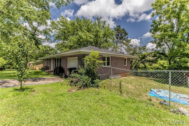 304 Warren St, Richland, MO 65556 - view of side of property featuring brick siding and an attached garage