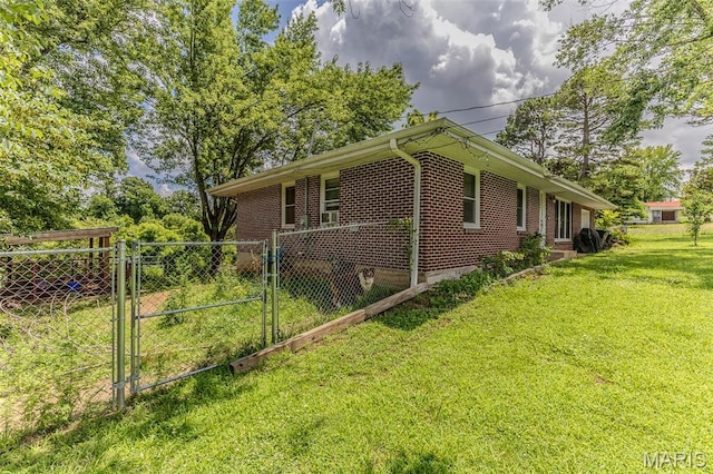 304 Warren St, Richland, MO 65556 - view of home's exterior with brick siding and a gate
