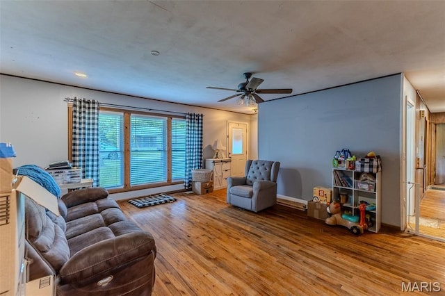 304 Warren St, Richland, MO 65556 - living room featuring hardwood / wood-style floors and ceiling fan