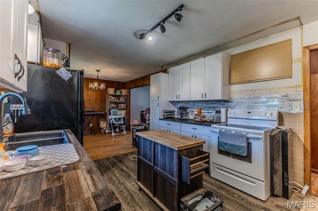 304 Warren St, Richland, MO 65556 - kitchen with electric range, wooden counters, white cabinetry, dark wood-style floors, and a chandelier