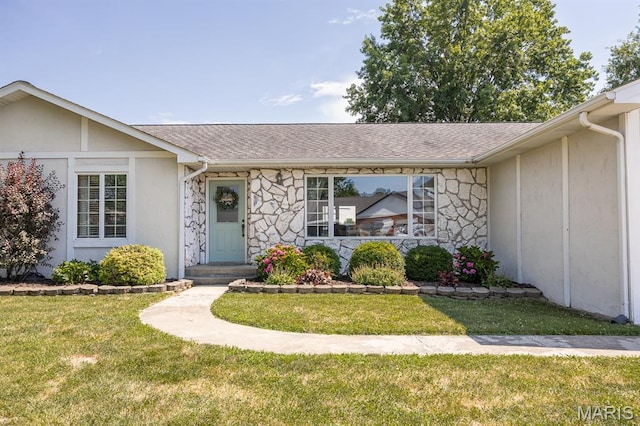 220 Southgate Dr, Freeburg, IL 62243 - view of front of home featuring stone siding, a front yard, a shingled roof, and stucco siding