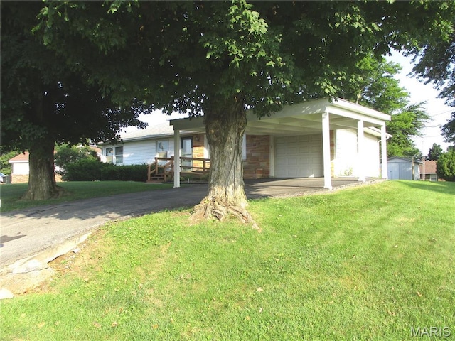 103 Paulette St, Chester, IL 62233 - ranch-style home with a front lawn, a shed, and driveway