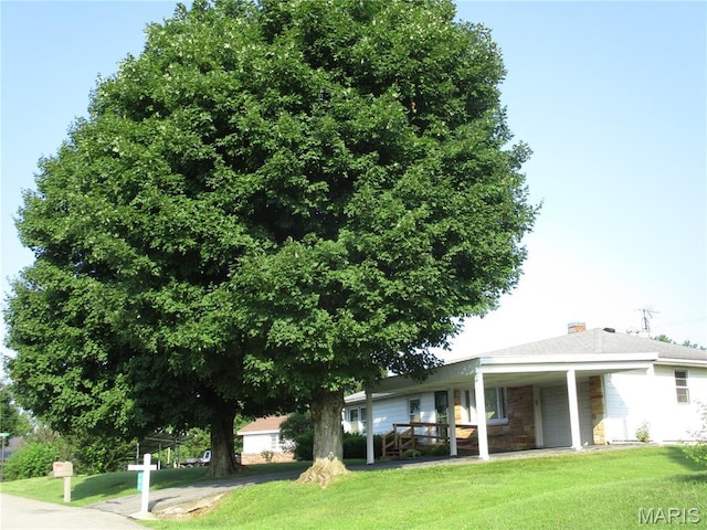 103 Paulette St, Chester, IL 62233 - rear view of house featuring a yard, covered porch, and an attached garage